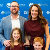 Satkoski posing with family members